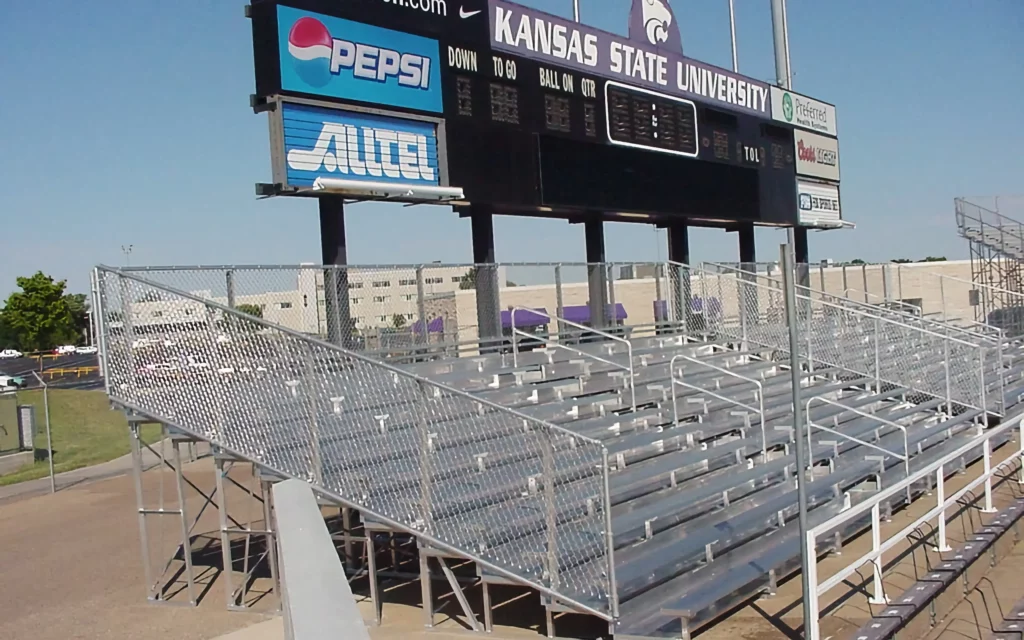 Outdoor non-elevated bleachers and scoreboard.