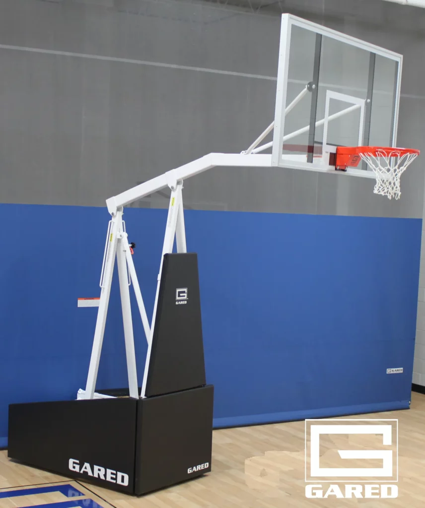 Indoor, portable basketball system: pole, backboard, rim, and net.